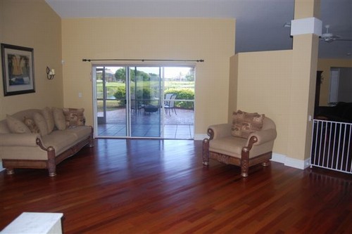 living room. upon entering the home, you will be impressed by the real brazilian cherry wood floors throughout the living areas and all bedrooms.