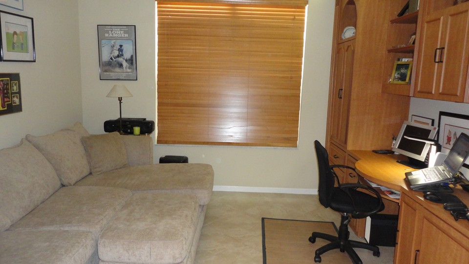 den the 3rd bedroom/den features pocket doors and a beautiful built-in wall unit.