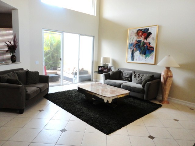 living room the living room has an open feel with volume ceilings & lots of natural light.