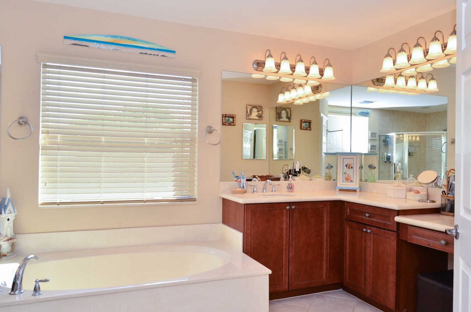 master bathroom the gorgeous master bathroom has separate vanaties with marble counters, wood cabinets, a roman tub and upgraded shower tile.