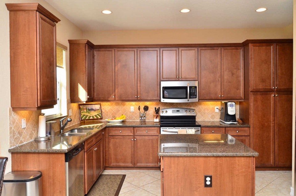 kitchen the stunning kitchen is a chef's delight with 42 wood cabinets, granite counters and stainless steel appliances.