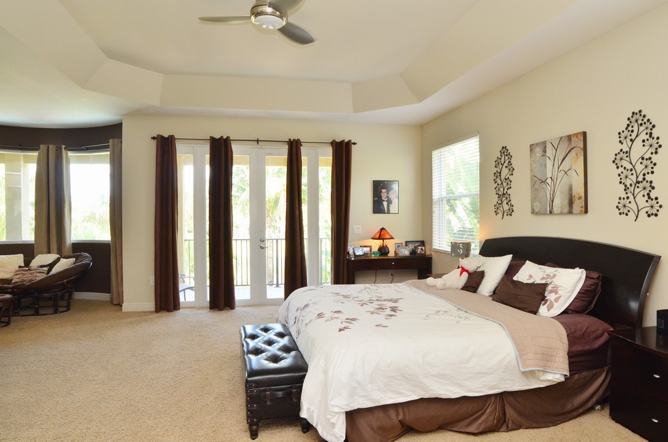 master suite the massive master retreat includes a huge sitting room and french doors leading out to the baclony overlooking the pool and lake.