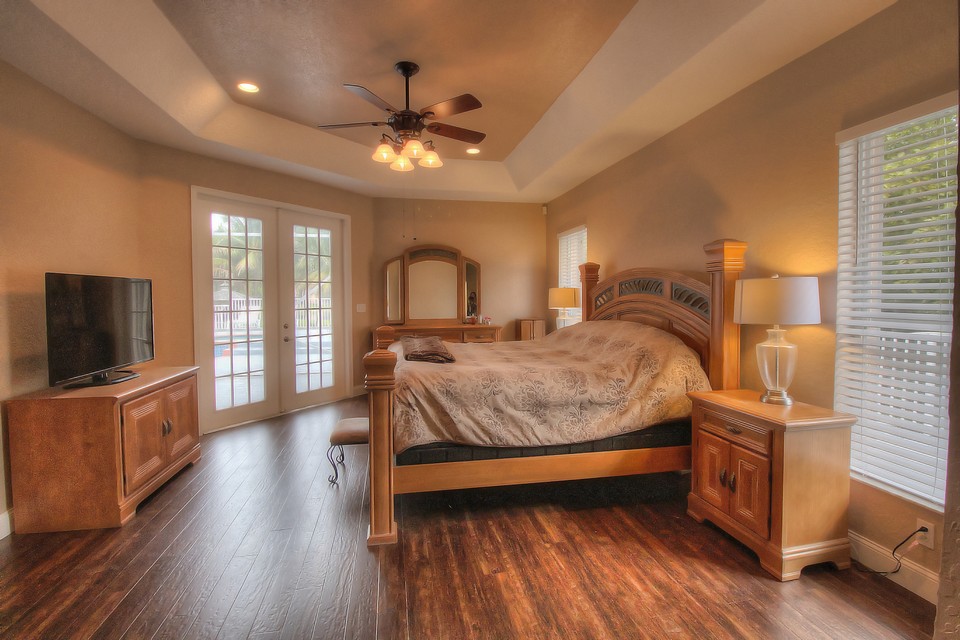 the large master suite haswalk-in closets & a set of french doors that lead to the patio.