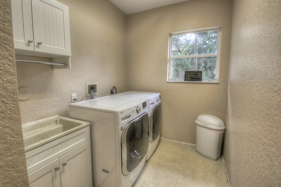 the laundry room has a brand new front load washer & dryer.