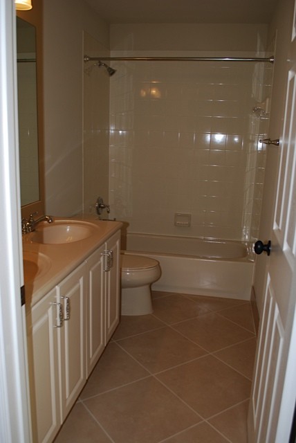 upstairs bathroom with dual sinks,.