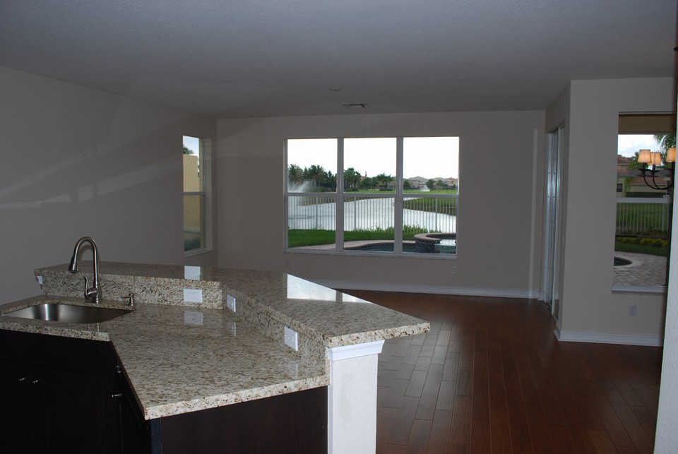 view what a stunning view from the kitchen straight out to the pool and lake!
